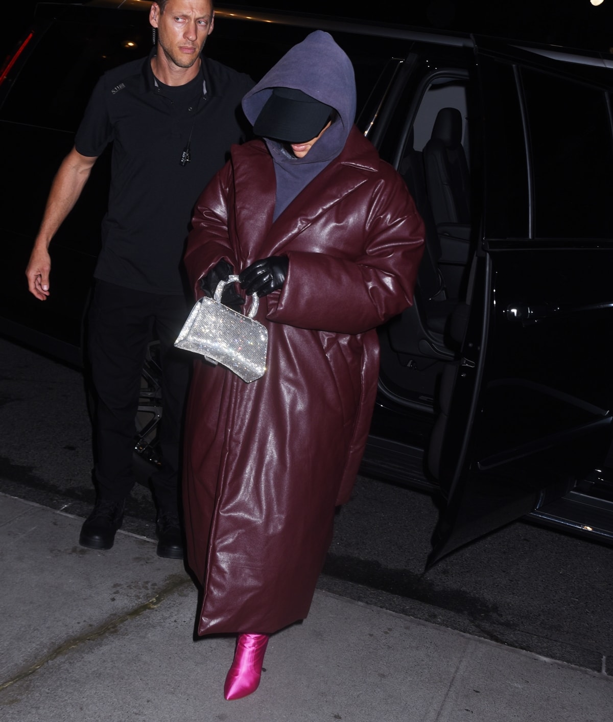 Kim Kardashian returns to her hotel in a padded leather Balenciaga coat after SNL rehearsals