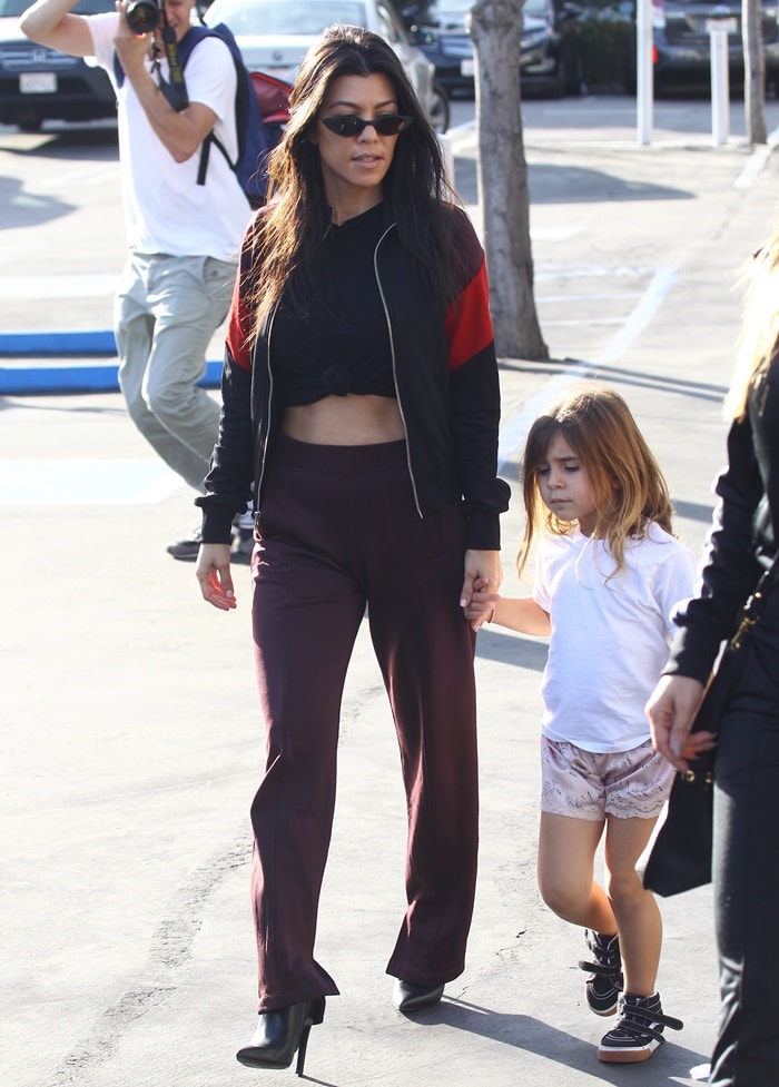 Kourtney Kardashian completed the outfit with her favorite Balenciaga 'Knife' boots