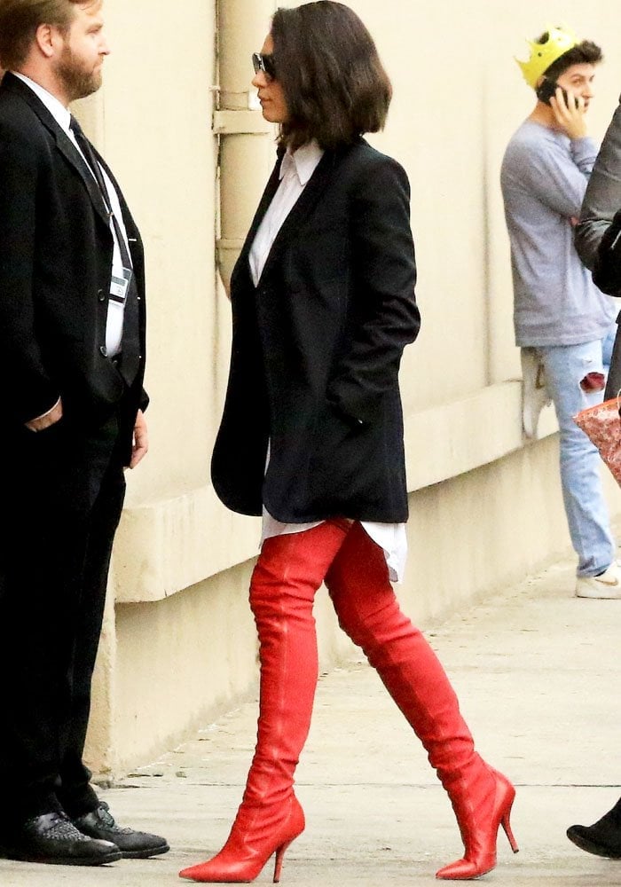 Mila enters the studio looking sharp in a full Fendi ensemble