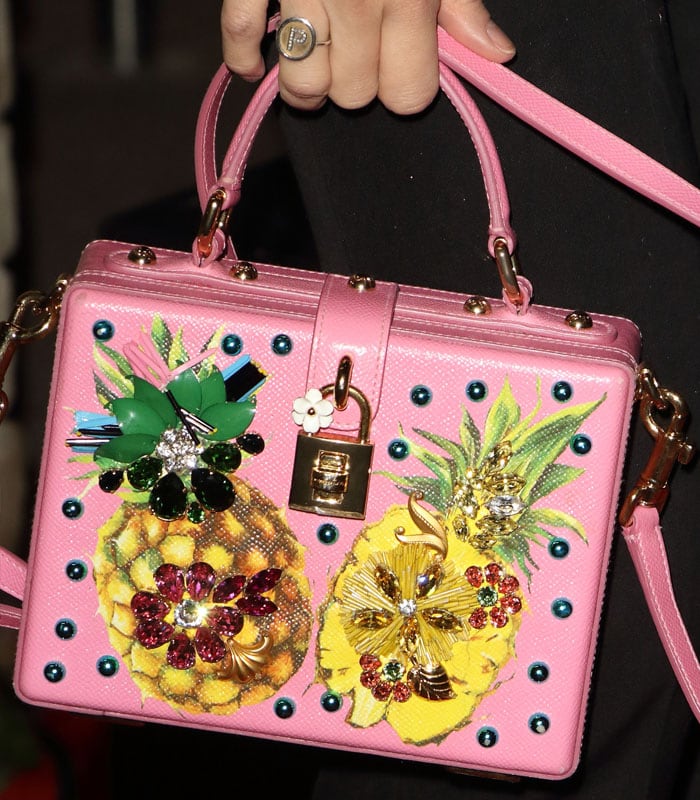 Details of Pixie Lott's pink Dolce & Gabbana embellished pineapple handbag.