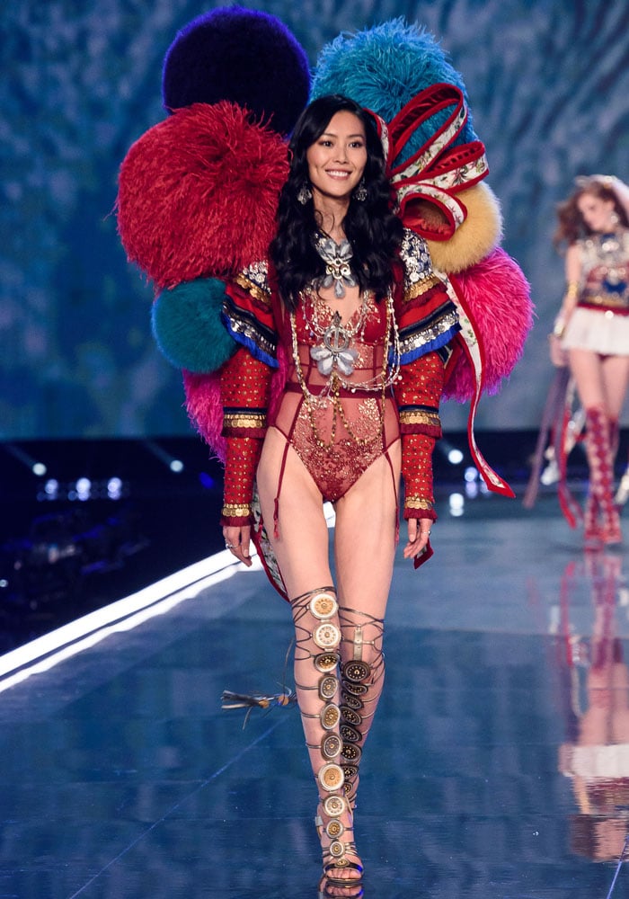 Liu Wen dazzles in a pair gigantic pom pom wings