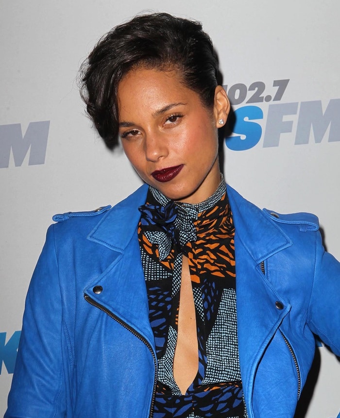 Alicia Keys wearing a light-blue leather moto jacket