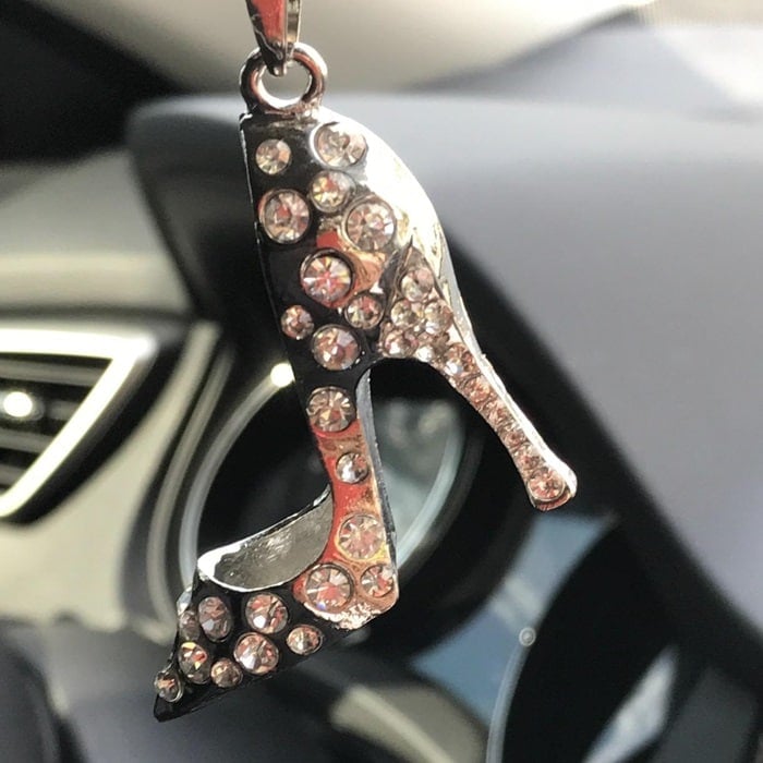 Customers showing off their rearview mirror shoe ornaments