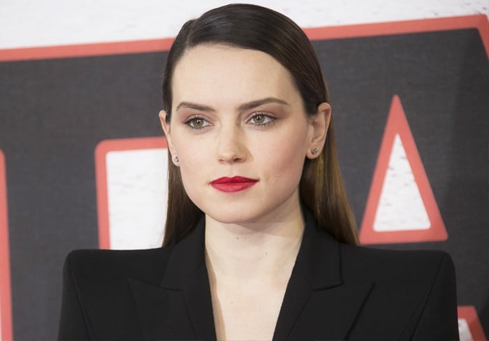 The actress puts on a vampy look with bold red lips