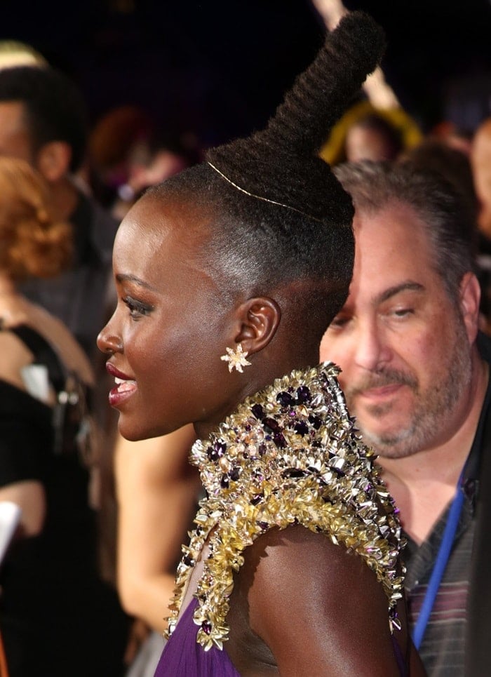 Lupita Nyong’o wore her long hair up in a chic top bun