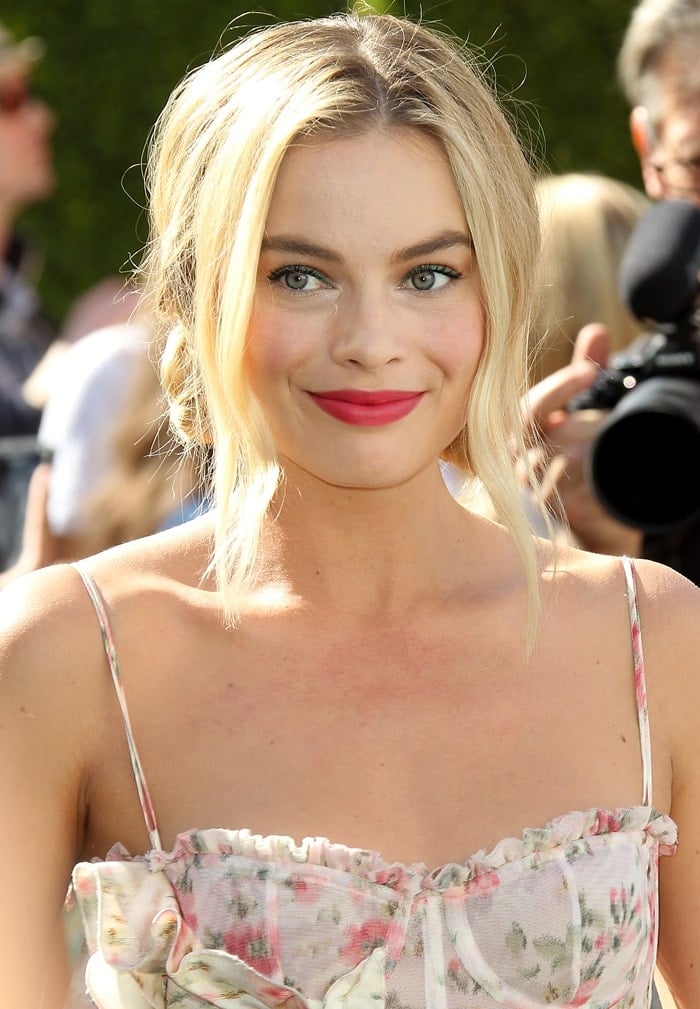 Margot Robbie stunned in a white floral dress at the premiere of her movie 'Peter Rabbit' at The Grove in Los Angeles on February 3, 2018
