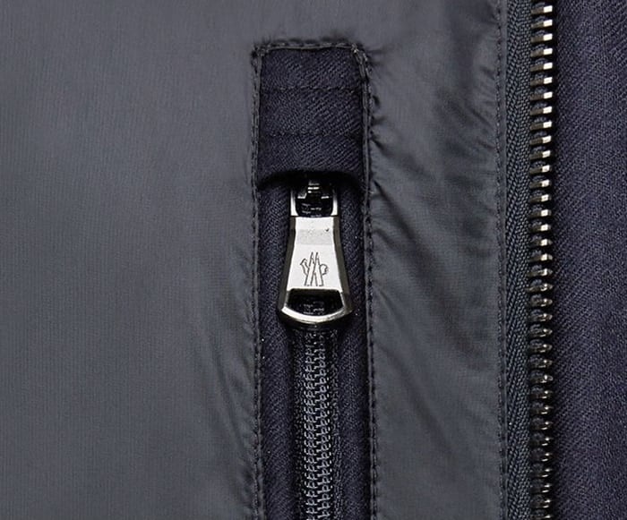 Inspect the Moncler zippers and buttons very closely