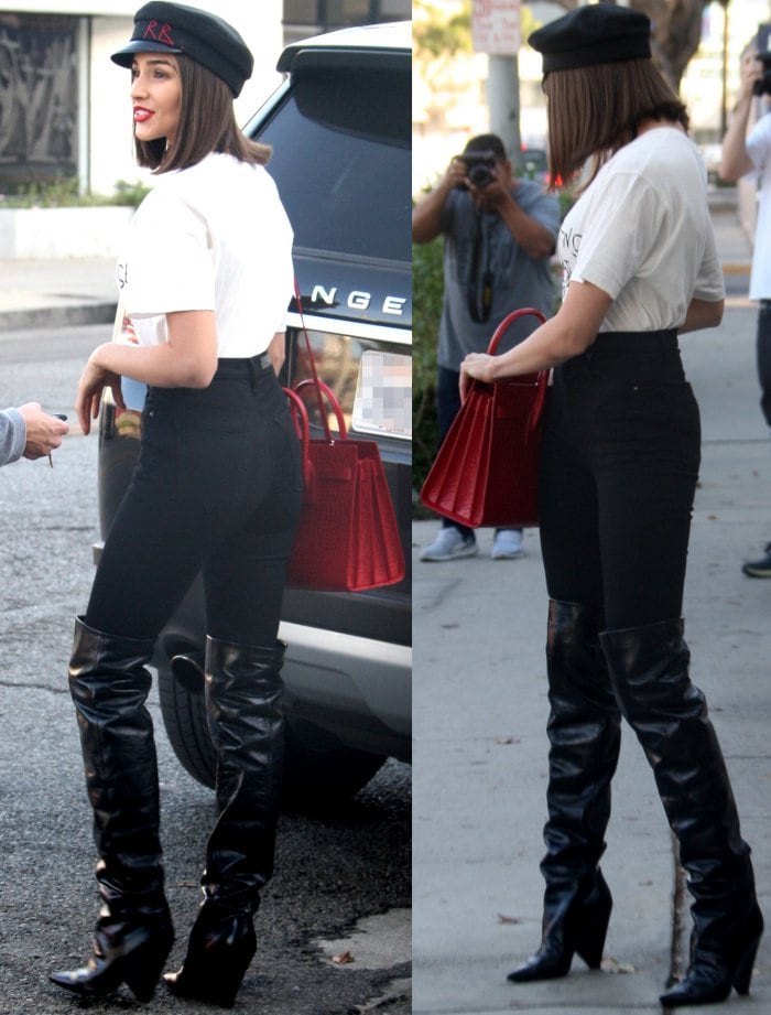 Olivia Culpo wearing the Gucci "Coco Capitan" logo shirt, GRLFRND "Kendall" skinny jeans, and Saint Laurent "Niki" glossed-leather knee boots while out and about in Los Angeles