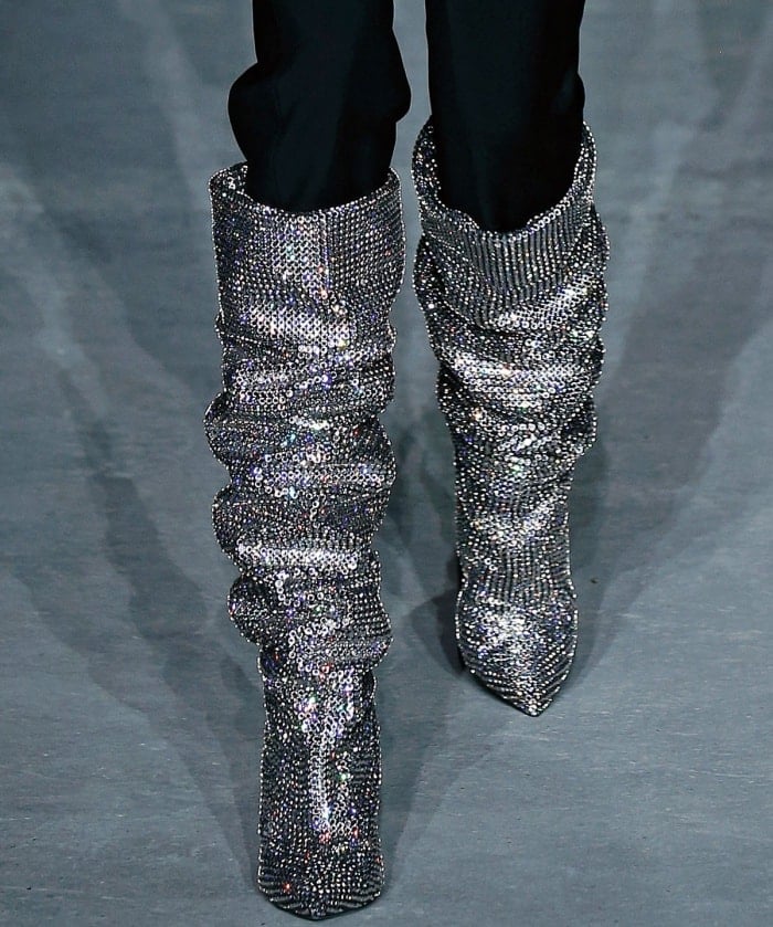 Model wearing Saint Laurent’s "Niki" crystal-embellished over-the-knee boots