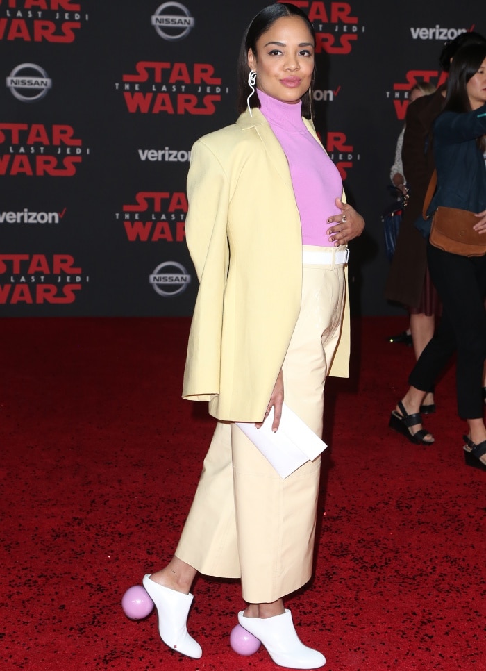 Tessa Thompson wears a wide-legged yellow Solace London pantsuit at the "Star Wars: The Last Jedi" premiere