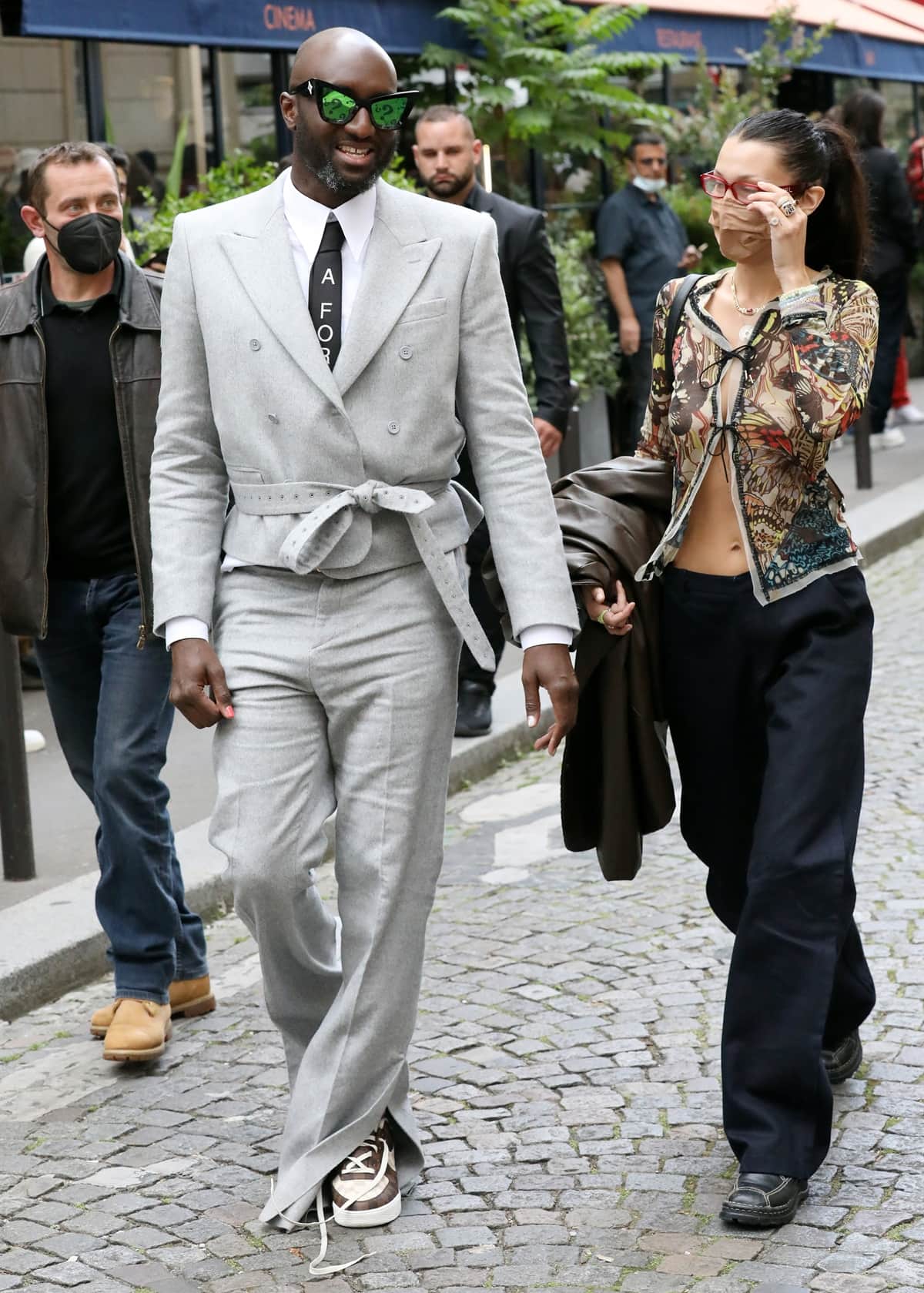 Fashion designer Virgil Abloh and Bella Hadid strolling in Saint Germain