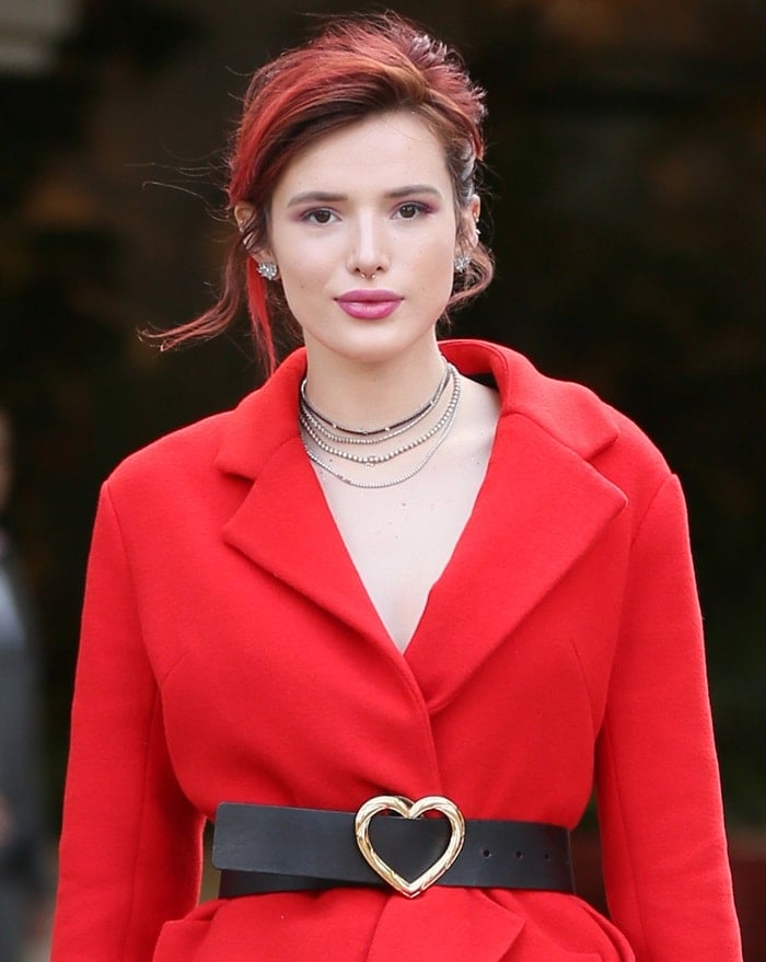 Bella Thorne's red coat and a heart-detailed black belt