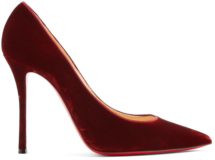 Christian Louboutin's burgundy velvet 'Decoltish' pumps are crafted in Italy with a sharp point toe and sultry curved high stiletto heel