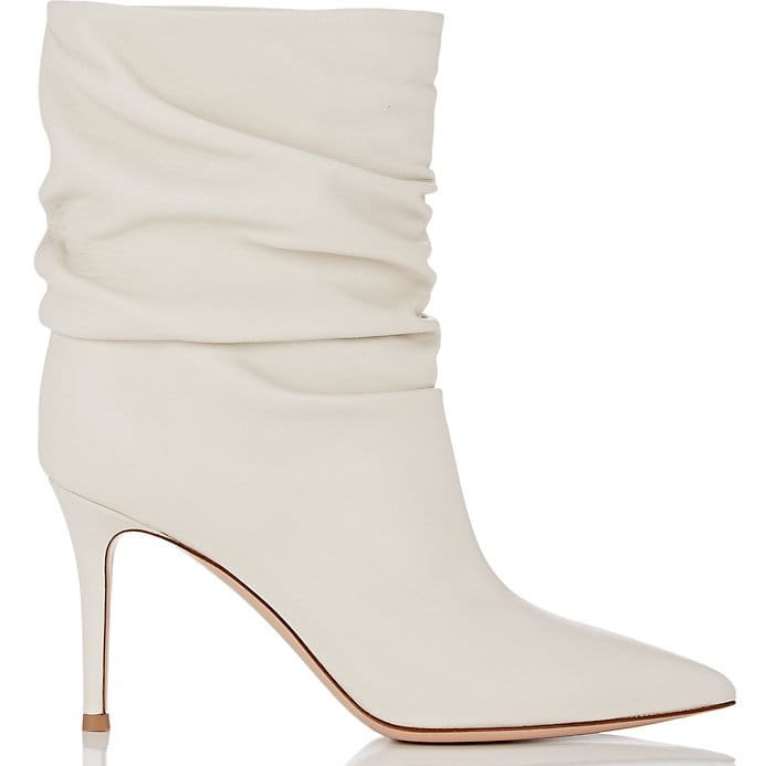 Gianvito Rossi's off-white nappa leather 'Cecile' ankle boots feature a pointed toe and leg-lengthening stiletto heel