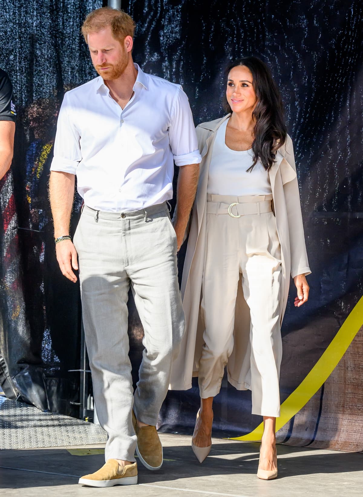 At the Invictus Games Düsseldorf 2023 in Dusseldorf, Germany, on September 16, Prince Harry, Duke of Sussex, standing 6 feet 1 ¼ inches, and Meghan, Duchess of Sussex, at 5 feet 5 inches, attended the swimming medal ceremony, showcasing their poise and height difference