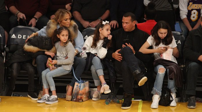 Jennifer Lopez watches the Los Angeles Lakers game alongside her twins, Emme and Maximilian, and Alex Rodriguez with his daughters, Ella and Natasha, on January 5, 2018