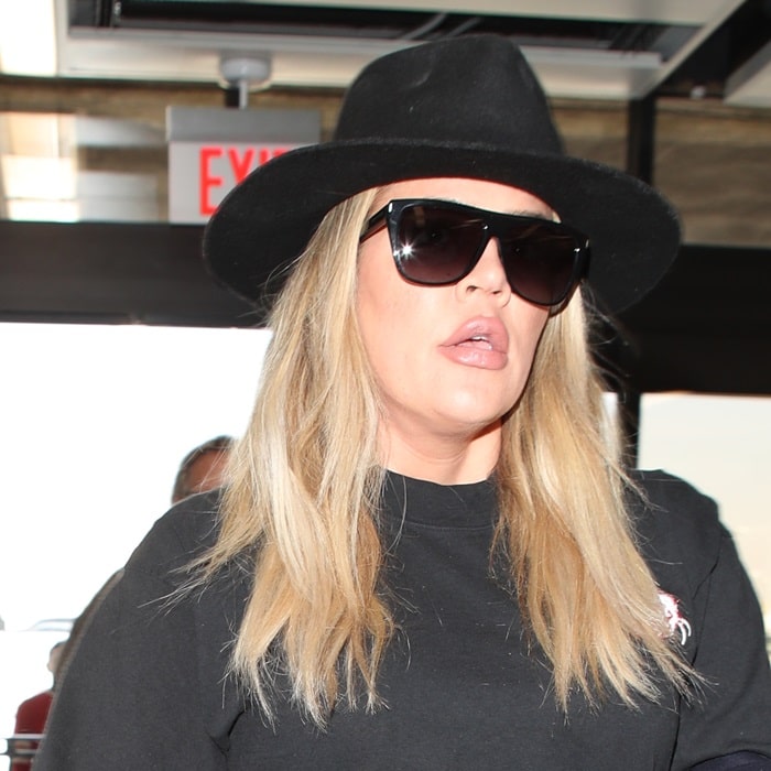 Khloé Kardashian with an open mouth shows off her super-sized lips