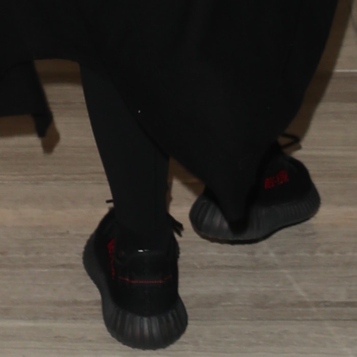 Khloé Kardashian wearing Kanye West's $1,000 primeknit Yeezy x Adidas Boost 350 V2 low-top sneakers