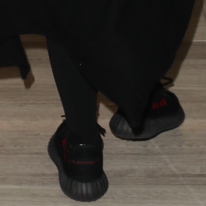 Khloe Kardashian wearing Kanye West's $1,000 primeknit Yeezy x Adidas Boost 350 V2 low-top sneakers