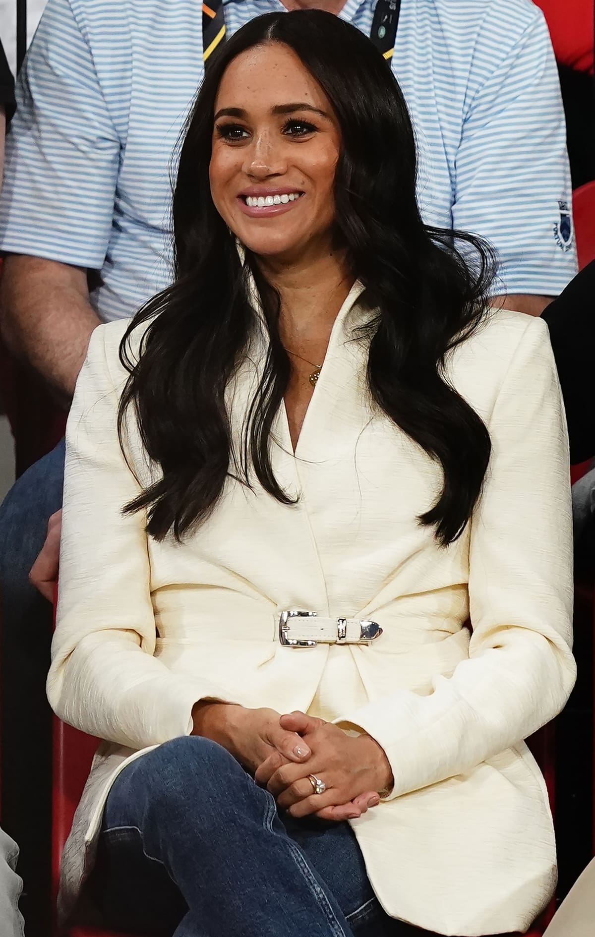 Meghan Markle wore a white Brandon Maxwell belted jacket with jeans