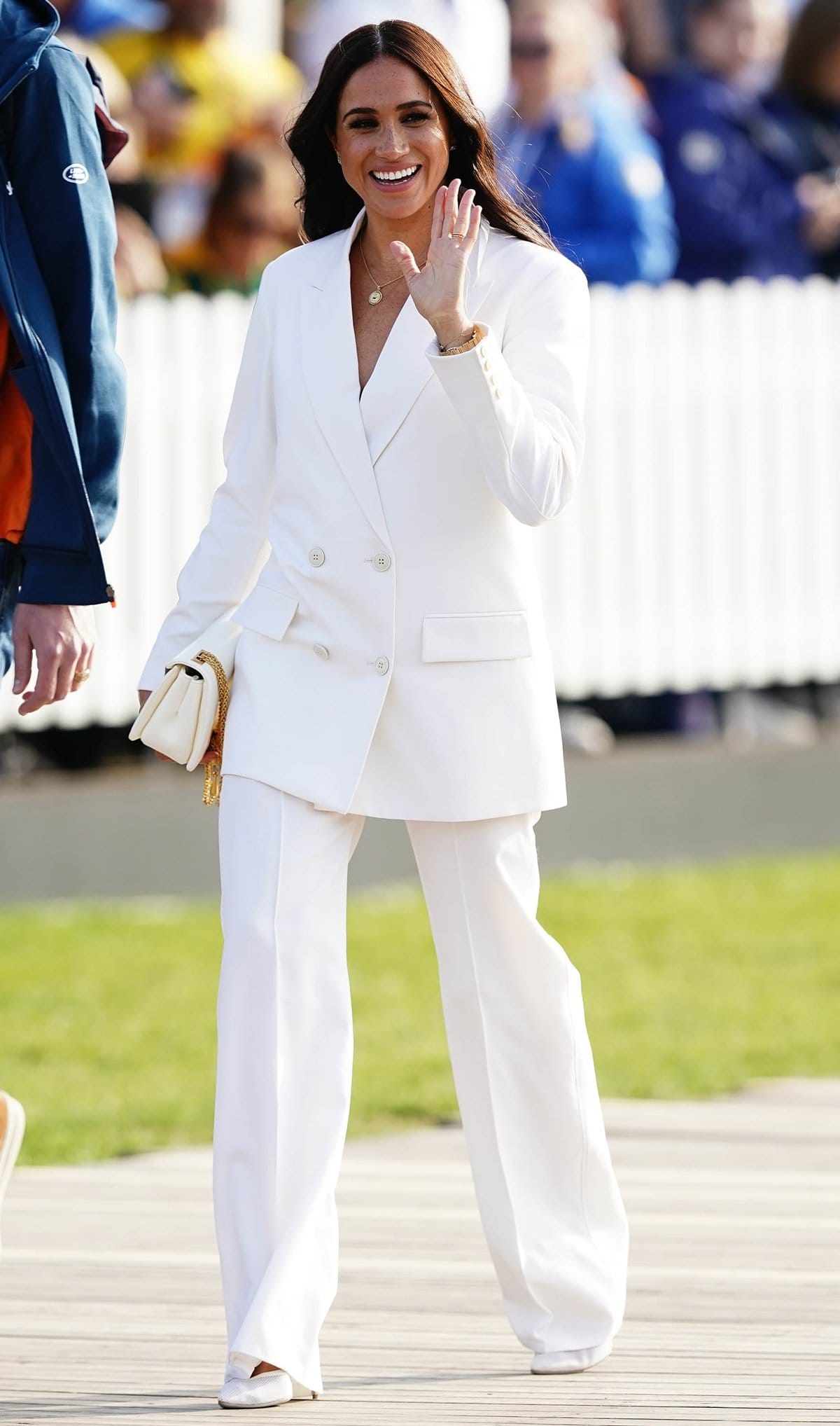 Meghan Markle wore a white Valentino suit and bag with Cartier earrings, Sophie Lis necklace, and Aquazzura heels