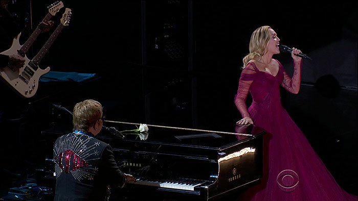 Miley Cyrus taking the stage with Sir Elton John to perform his classic hit song, 'Tiny Dancer," at the 2018 Grammy Awards held at Madison Square Garden in New York City on January 28, 2018.