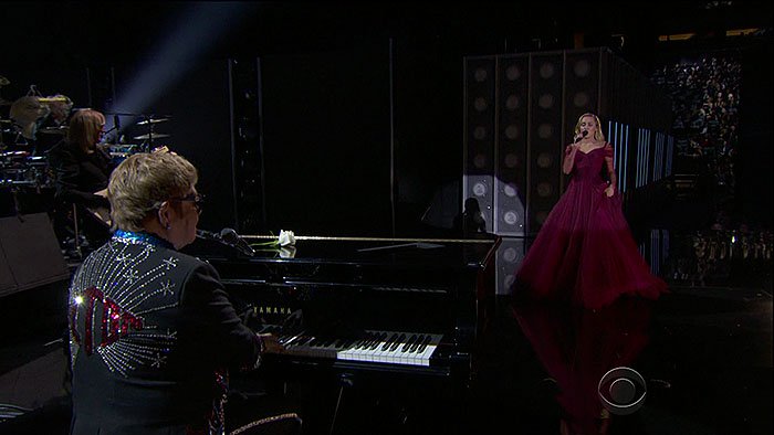 Miley Cyrus taking the stage with Sir Elton John to perform his classic hit song, 'Tiny Dancer," at the 2018 Grammy Awards held at Madison Square Garden in New York City on January 28, 2018.