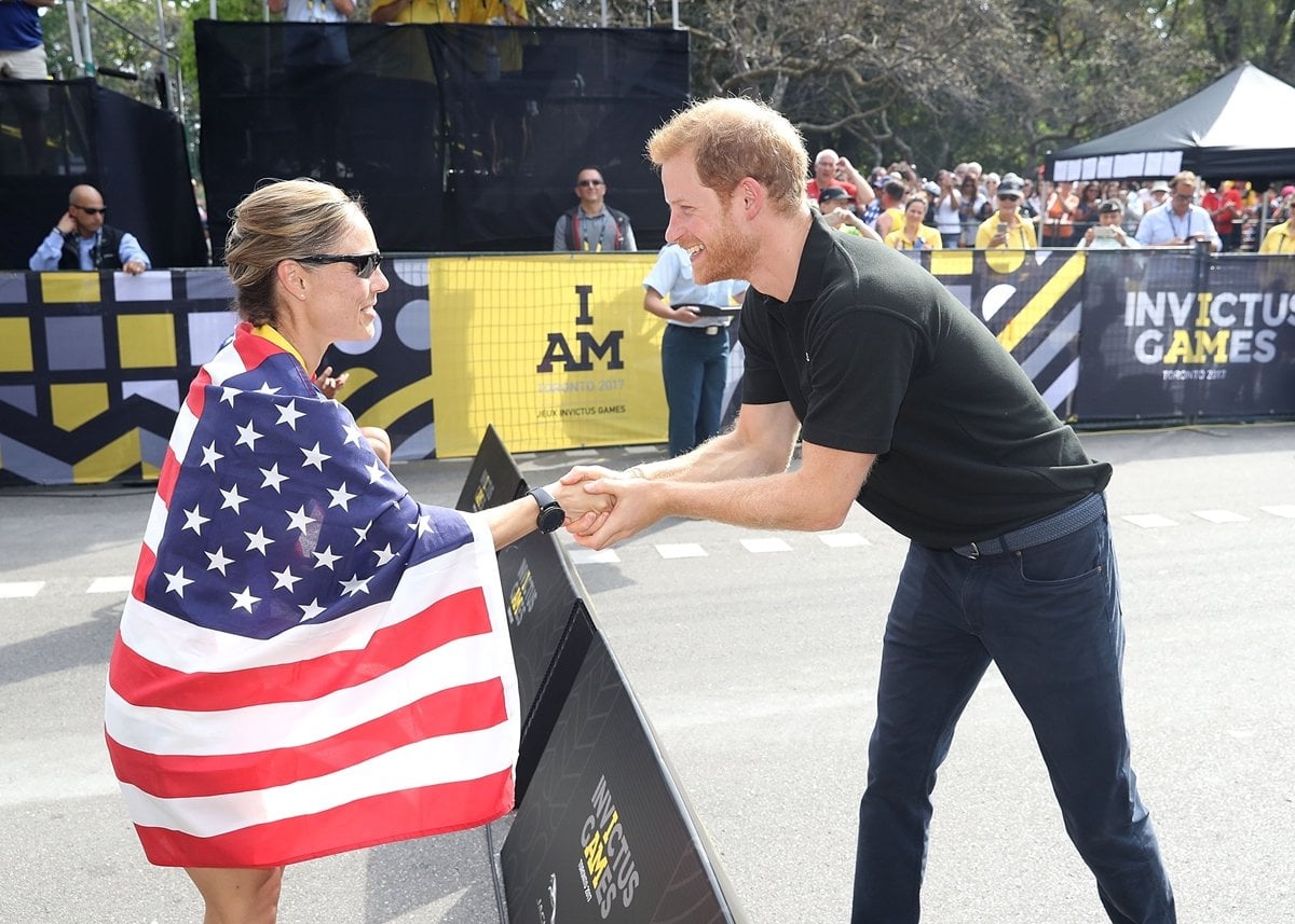 Prince Harry congratulates Julie Marcotte on winning Gold in the Cycling Time Trial during the Invictus Games 2017