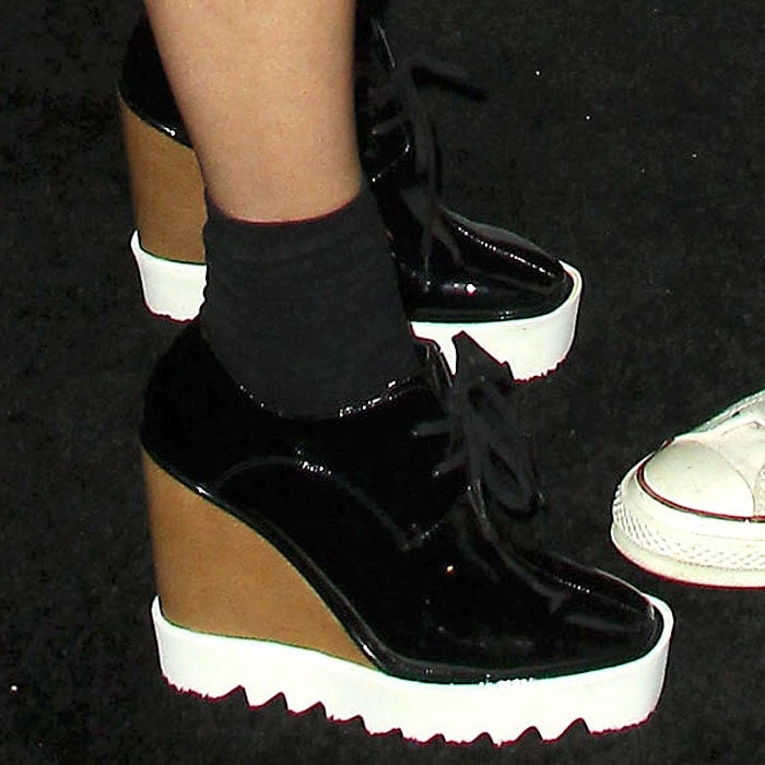 Closeup of Vanessa Hudgens' Stella McCartney 'Elyse' black-patent wedge platform oxfords.