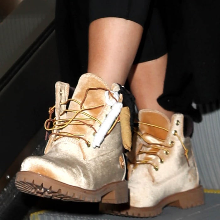 Khloe Kardashian wearing Timberland x Off-White leather lace-up boots at the Los Angeles International Airport