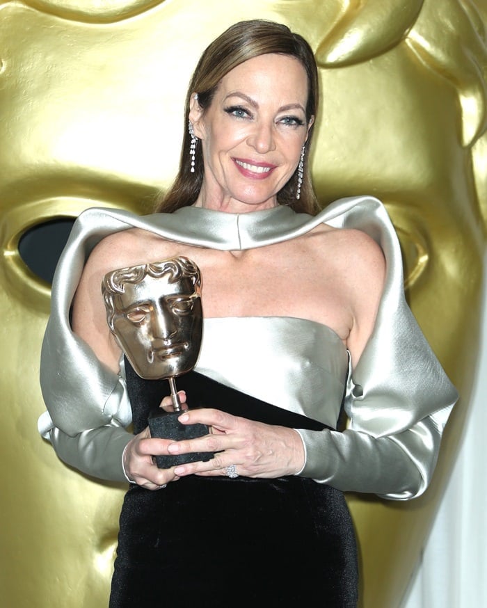 Allison Janney proudly holds her Best Supporting Actress BAFTA award while wearing a striking two-tone Bibhu Mohapatra gown at the 2018 British Academy Film Awards (BAFTAs)
