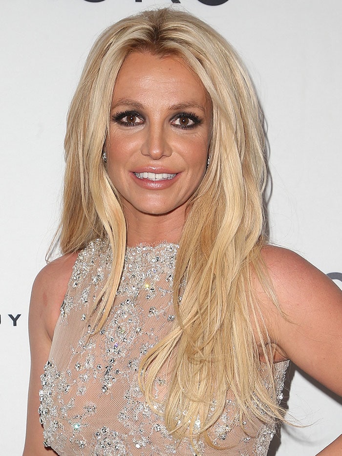 Britney Spears tries to smile