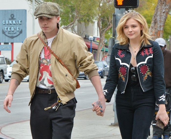 Chloë Grace Moretz styled her almond toe boots with a matching top and dark wash MOTHER ankle jeans