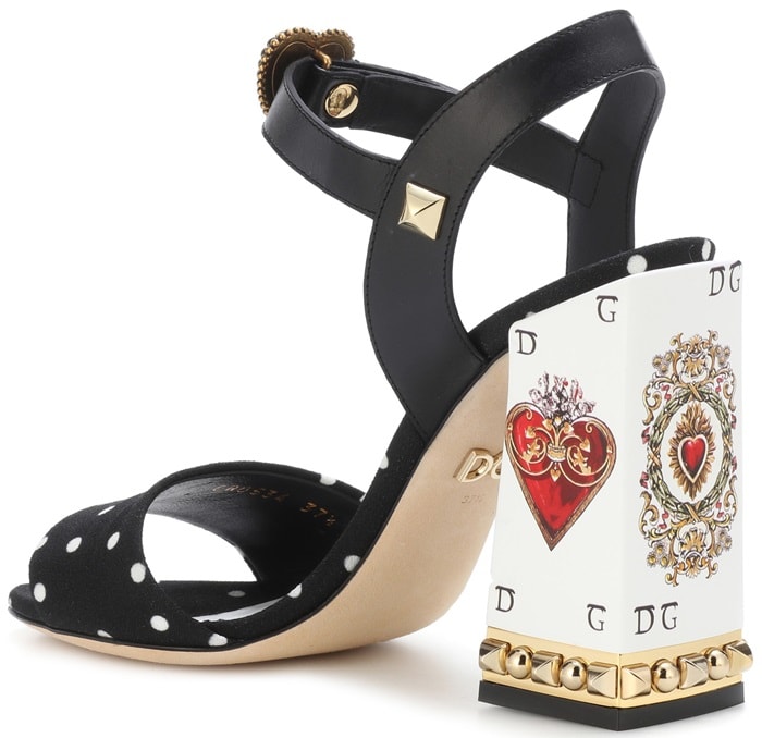 The design has a polka-dotted fabric band across the toe, as well as a leather ankle strap embellished with a D&G heart and pyramid studs