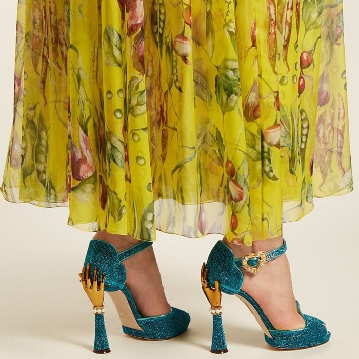 These unique turquoise-blue sandals from Dolce & Gabbana are finished with a gold-tone hand that sits atop a sculpted towering heel