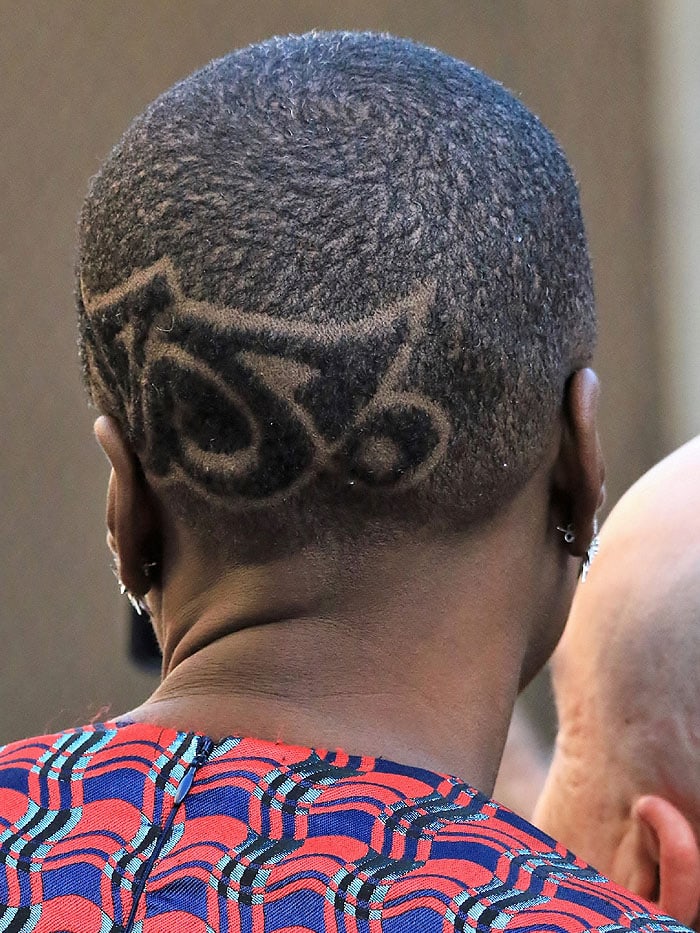 Danai Gurira rocking a patterned design in her shaved buzz cut hairdo.