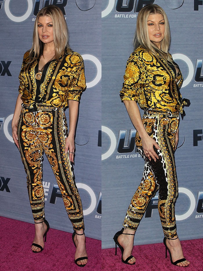 Fergie in a yellow-and-black printed shirt and pants from Versace