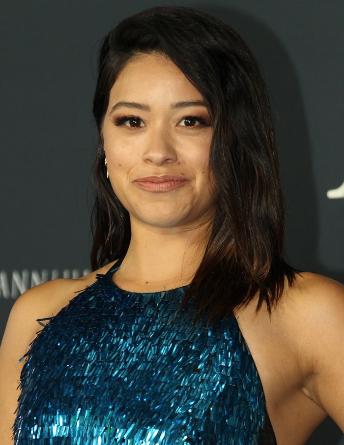 Gina Rodriguez in a slinky turquoise ombré beaded halter gown from Cristina Ottaviano’s Fall 2017 collection