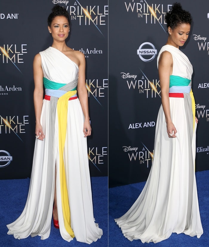 Gugu Mbatha-Raw wearing a white one-shoulder dress from the Vionnet Spring 2018 collection featuring pleated panels at the premiere of 'A Wrinkle in Time' at the El Capitan Theatre in Los Angeles on February 26, 2018