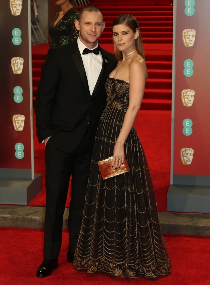 Jamie Bell and Kate Mara smiling to the cameras at the 2018 EE British Academy Film Awards held at Royal Albert Hall in London, England, on February 18, 2018