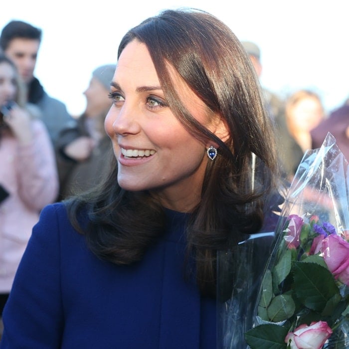 Catherine, Duchess Of Cambridge (aka Kate Middleton) wearing a marine blue Goat coat while greeting visitors at the opening of the Action On Addiction Community Treatment Centre in Wickford, England, on February 7, 2018