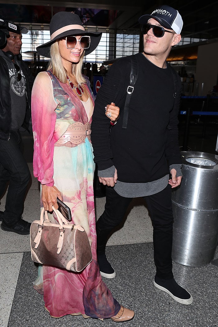 Paris Hilton and fiancé Chris Zylka departing from Los Angeles International Airport (LAX) in Los Angeles, California, on January 24, 2018.