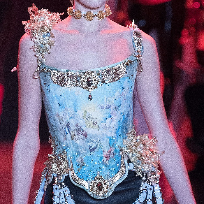 Corset featuring an angel painting print and gold-and-pearl embellishments.