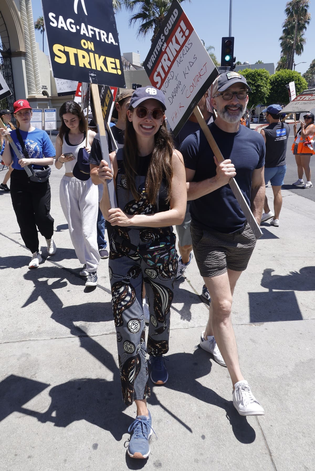 Alison Brie joins fellow SAG-AFTRA members on the picket line at Paramount Pictures Studios in Los Angeles, showing her support for the ongoing strike in a stylish patterned outfit and sneakers