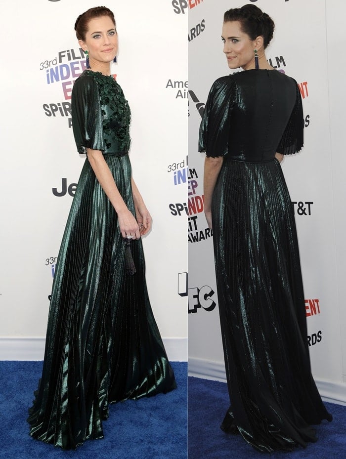 Allison Williams wearing a metallic Andrew Gn dress featuring pleats and velvet floral appliques