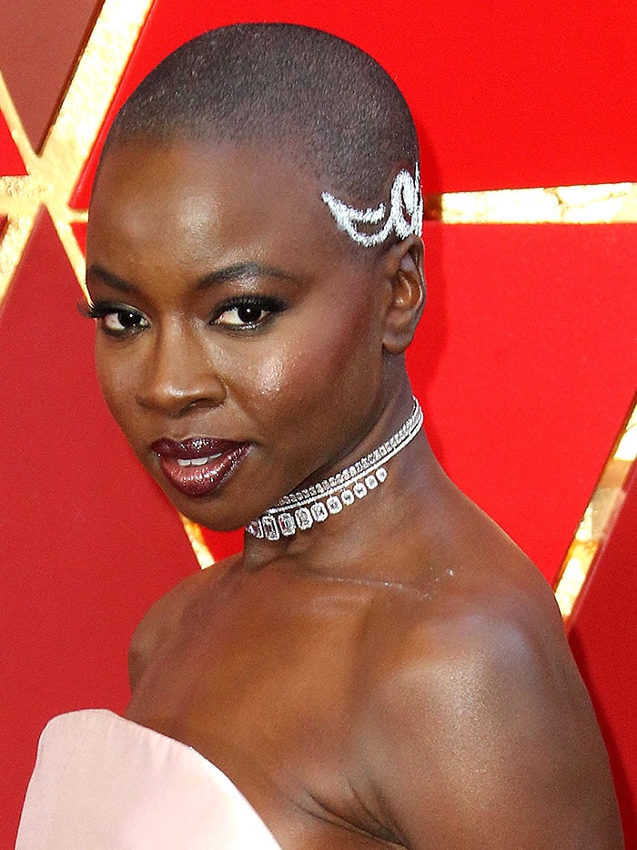 Danai Gurira rocking a jeweled buzz cut and a diamond choker at the 2018 Oscars.