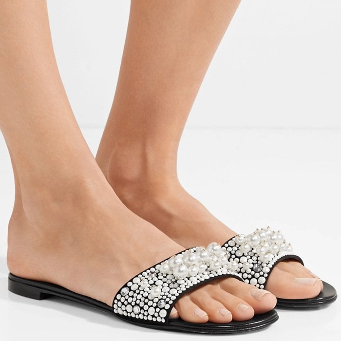 Though slides are typically casual by nature, this pair is decorated with scores of faux pearls and crystals