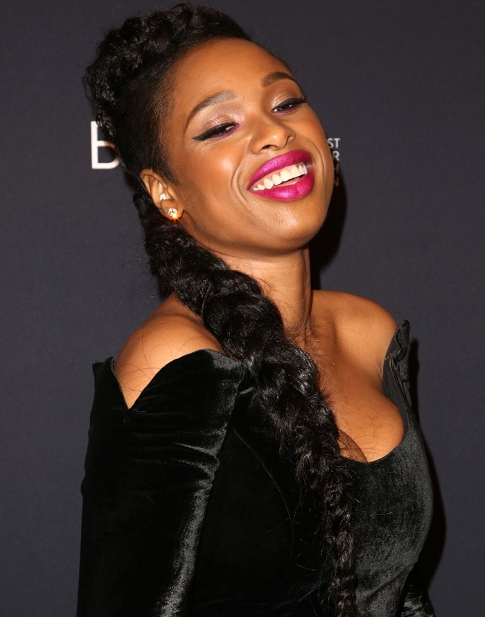 Jennifer Hudson wearing a long braided hairpiece