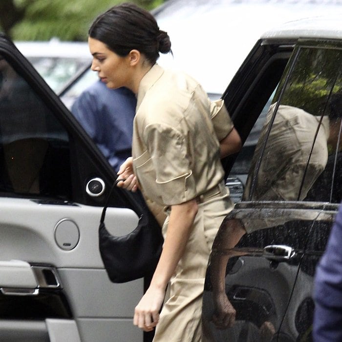 Kendall Jenner carrying a Prada bag while exiting her car