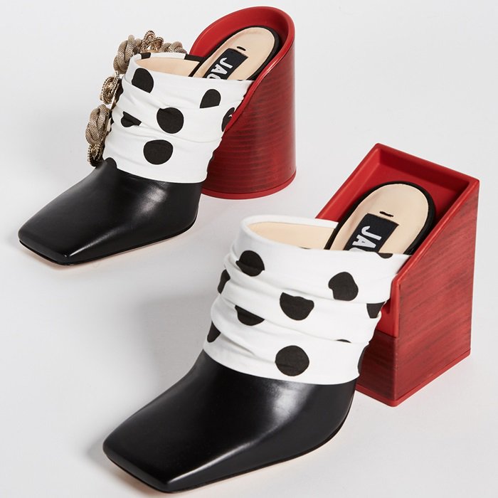 Oversized square and circle heels add a playful, bold aesthetic to these square-toe pumps